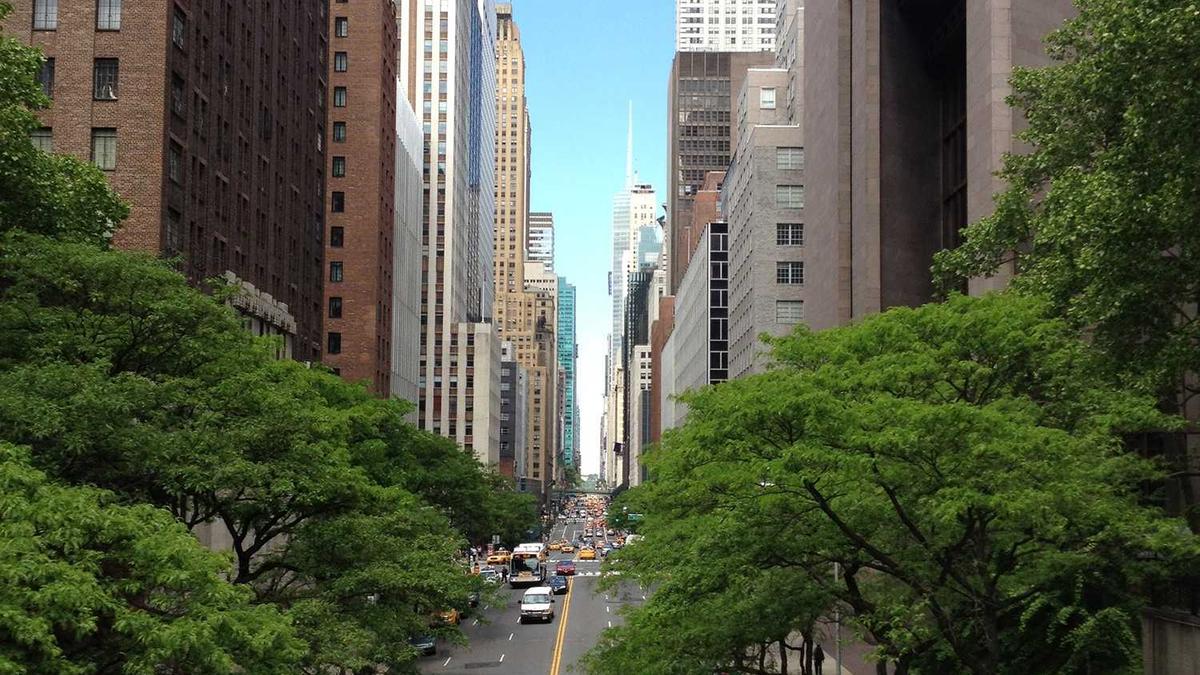 Representing Buildings in 2D Urban Inundation Models: Mesh Exclusion vs. High Roughness vs. Porosity Approaches